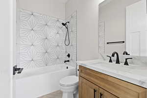 Bathroom with shower / washtub combination and vanity