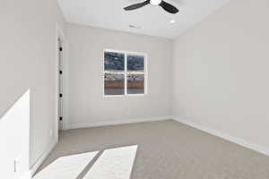 Carpeted empty room with recessed lighting and a ceiling fan
