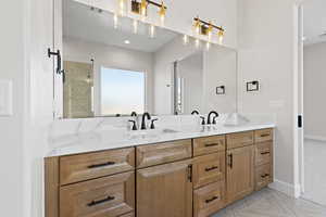 Bathroom with double vanity and recessed lighting