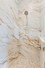 Full bathroom featuring a marble finish shower