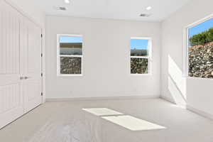 Unfurnished bedroom with carpet floors, recessed lighting, and a closet