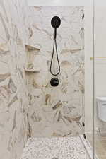 Full bathroom featuring a stall shower