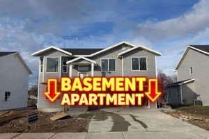 View of front facade featuring driveway