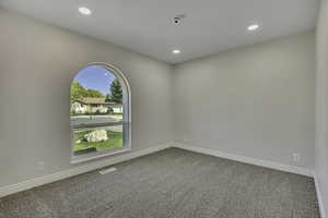 Unfurnished room featuring carpet flooring and recessed lighting
