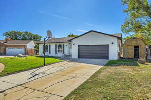 Single story home featuring brick siding, concrete driveway, and an attached garage