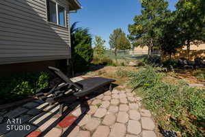 Fenced backyard featuring a patio