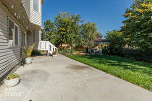 View of patio featuring a gazebo