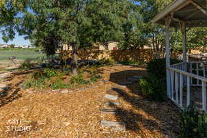 Fenced backyard with a gazebo