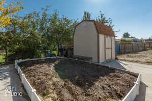 View of shed featuring a fenced backyard