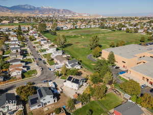 View of property location with mountains and nearby suburban area