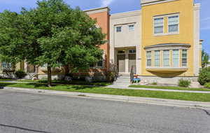 View of front of home featuring stucco siding