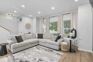 Living area featuring recessed lighting and light wood-style flooring