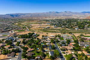 View of property location featuring nearby suburban area and a mountainous background