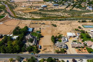 Aerial view of property and surrounding area featuring rural landscape