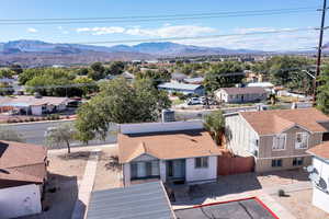Aerial view of residential area featuring a mountain backdrop