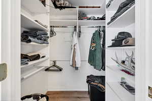 Spacious closet with wood finished floors