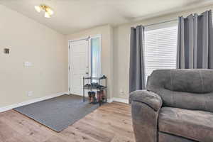 Sitting room featuring wood finished floors and baseboards