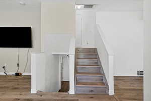 Staircase with wood finished floors