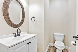 Bathroom featuring vanity and wood finished floors