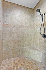 Full bathroom with a tile shower