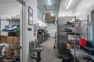 Kitchen with light tile patterned floors