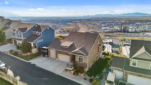 Aerial perspective of suburban area featuring a mountainous background