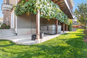 View of outdoor structure with a hot tub
