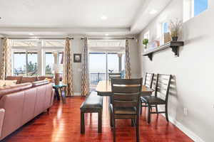 Dining room featuring dark wood-style floors and recessed lighting