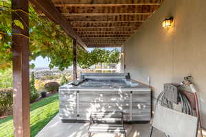 View of patio / terrace with a hot tub