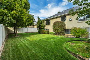 View of fenced backyard