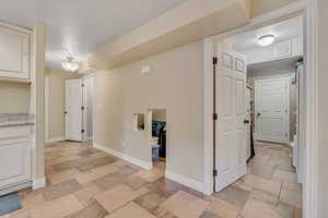 Hallway with stone tile flooring