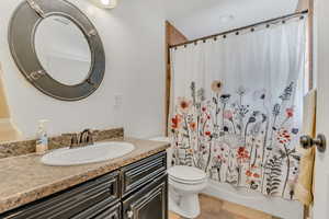 Bathroom featuring vanity and shower / bath combo