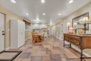 Dining area with baseboards and recessed lighting