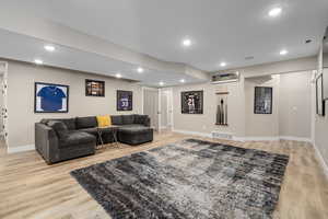 Living room featuring recessed lighting and light wood-type flooring