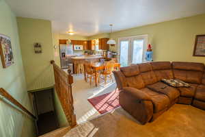 Living room featuring light flooring