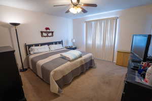 Primary Bedroom featuring carpet flooring and ceiling fan