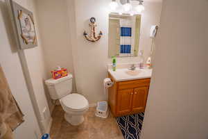 Full bath with vanity and a shower with curtain