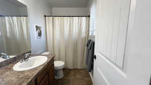 Full bathroom featuring vanity and a shower with curtain