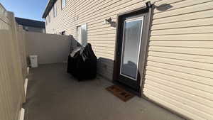 View of exterior entry featuring a patio