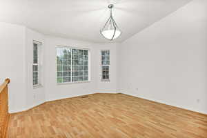 Living room with light wood-type flooring