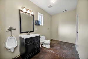 Shop half bath with concrete floors and vanity