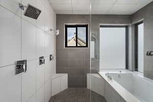 Full bathroom featuring a tile shower, tile walls, a garden tub, and dark tile patterned floors