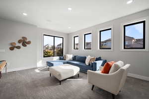 Living room with recessed lighting and carpet flooring