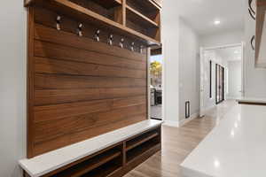 Mudroom featuring light wood-type flooring and recessed lighting