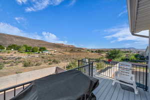 Wooden terrace featuring a mountain view