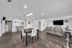 Dining room with recessed lighting and dark wood-type flooring