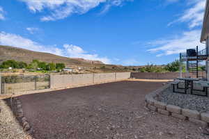 Fenced backyard with stairway