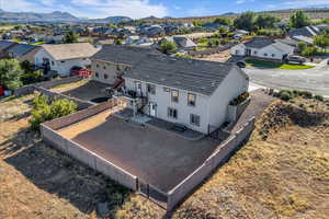 Aerial perspective of suburban area featuring a mountainous background