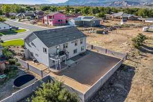 Aerial perspective of suburban area featuring a mountain backdrop