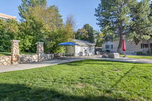 View of yard with a patio and an outdoor structure